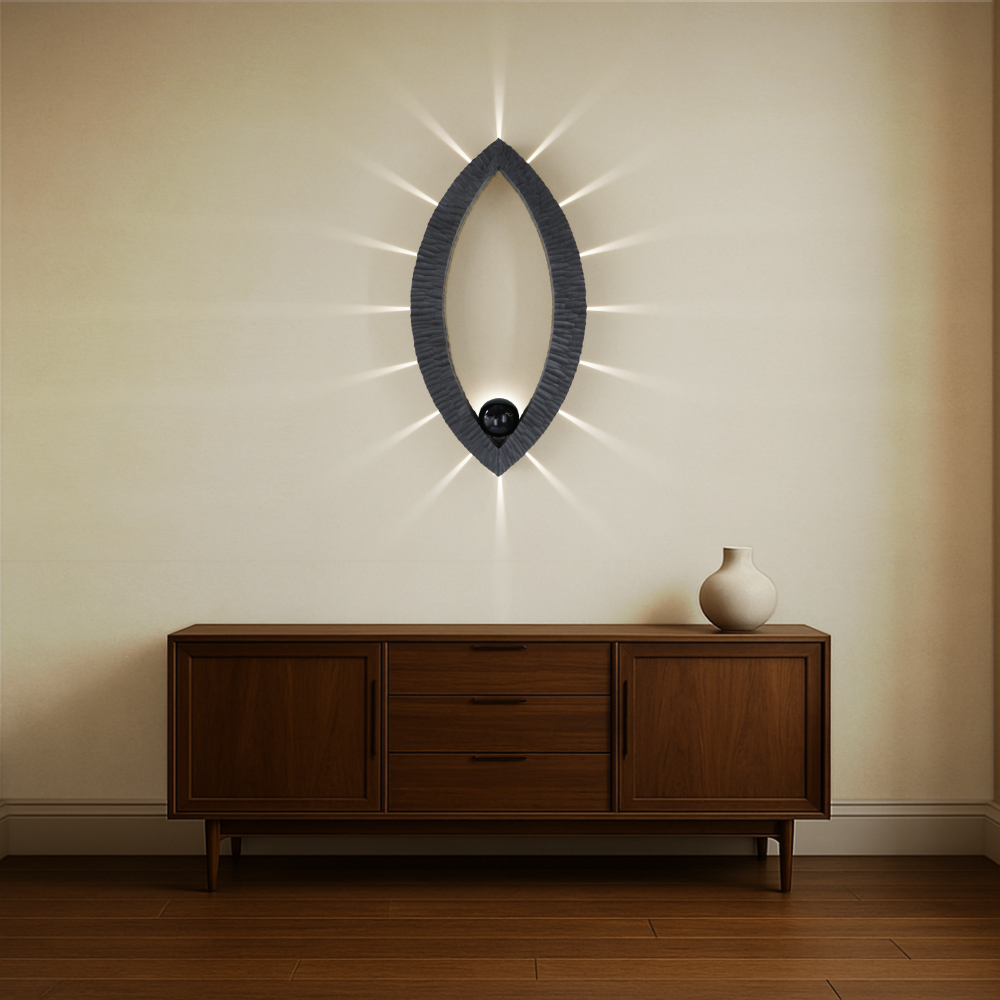 Sculptural wall lamp with an intricate Vesica-inspired geometric design, crafted from wood using fine cabinetmaking techniques. Mounted on a wall, it features a soft, dimmable LED light and a discreet button at the bottom for brightness control.